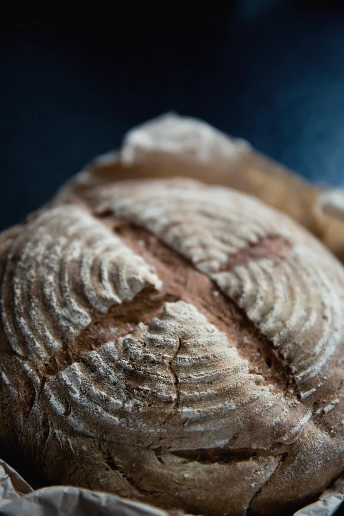 A crusty sourdough loaf dusted with flour